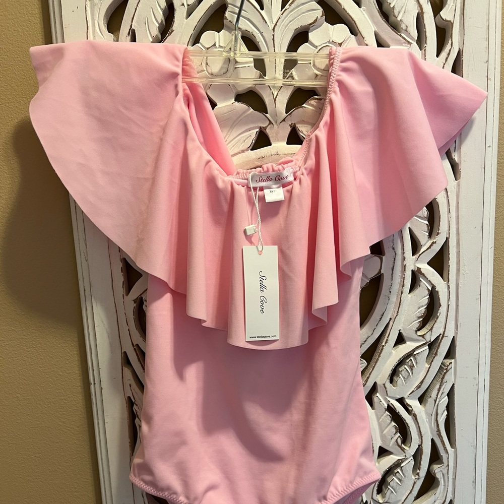Pink ruffle swim suit by Stella Cove